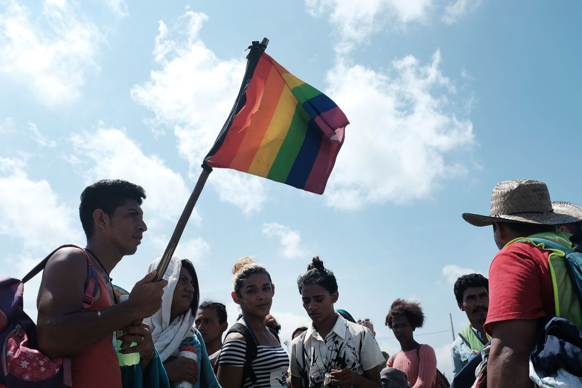 Members of an LGBT group traveling with the the Central American migrant caravan wait for a ride on November 1, 2018, in Juchitan de Zaragoza, Mexico.