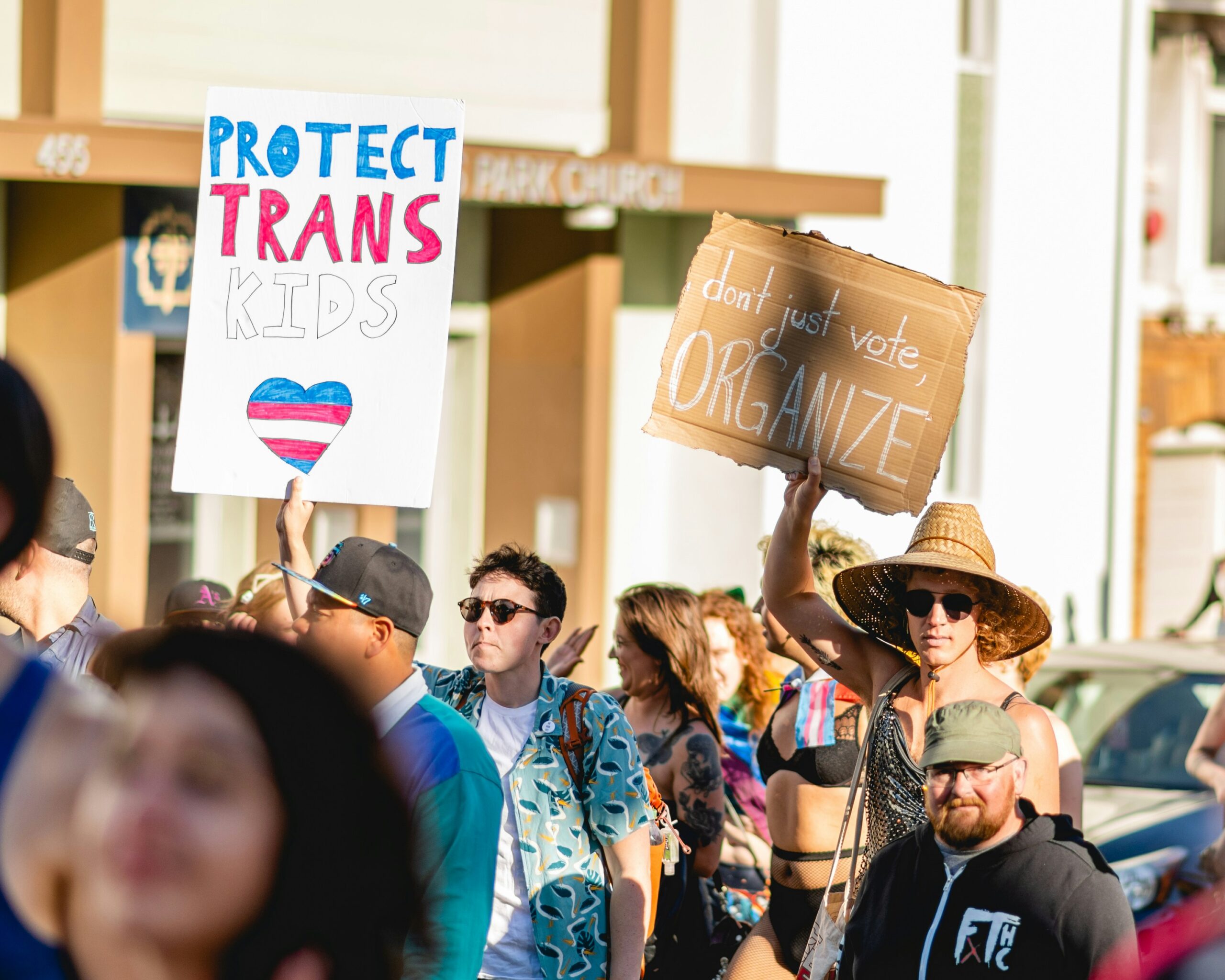 Photo of protestors holding signs.