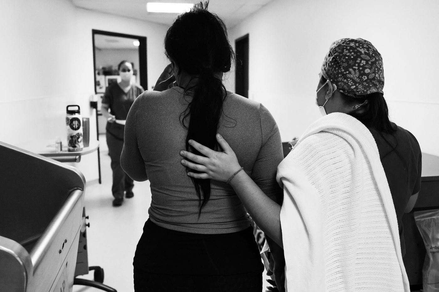 Black and White Photo of Two People in a Medical Setting