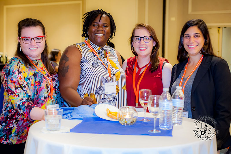 SFS18-Thursday-64 Photo of people at a cocktail table.