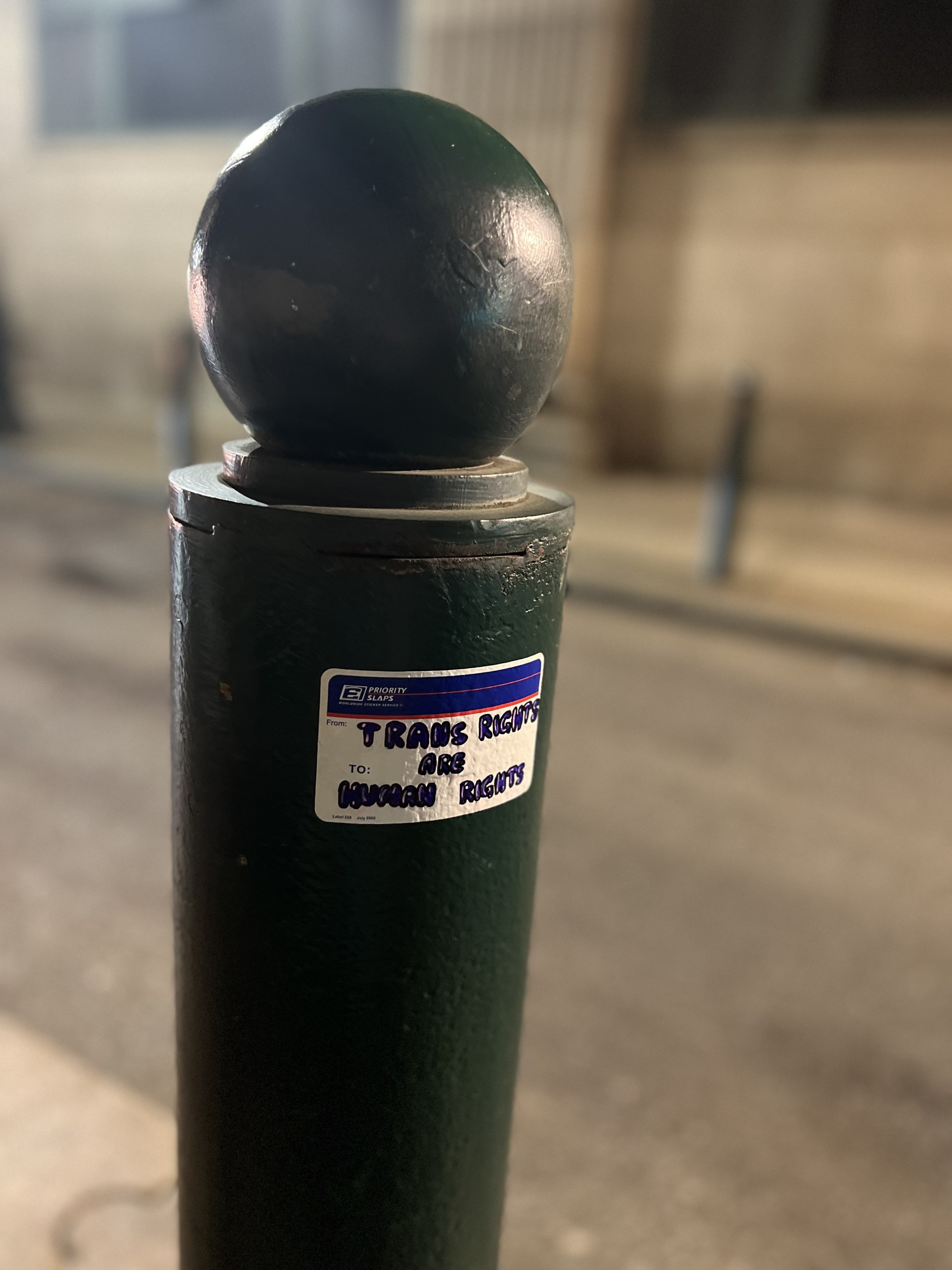 Photo of a sticker on a poll.