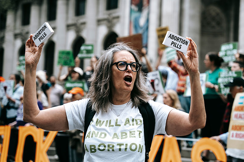 A photo of a person at a protest.