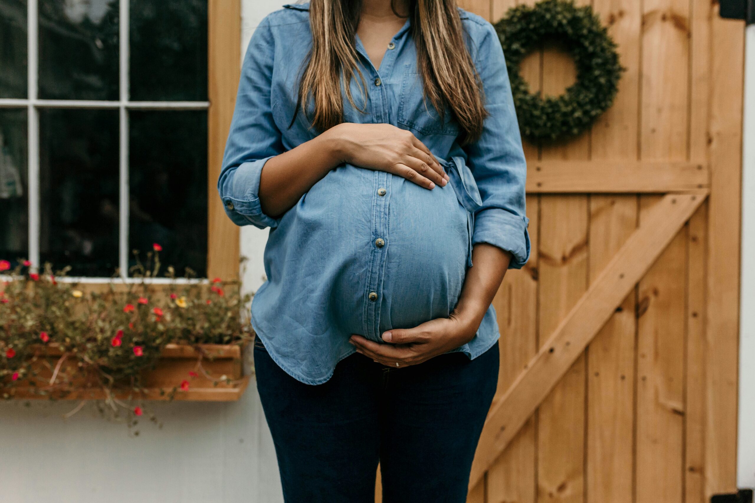 Photo of a pregnant person's belly.